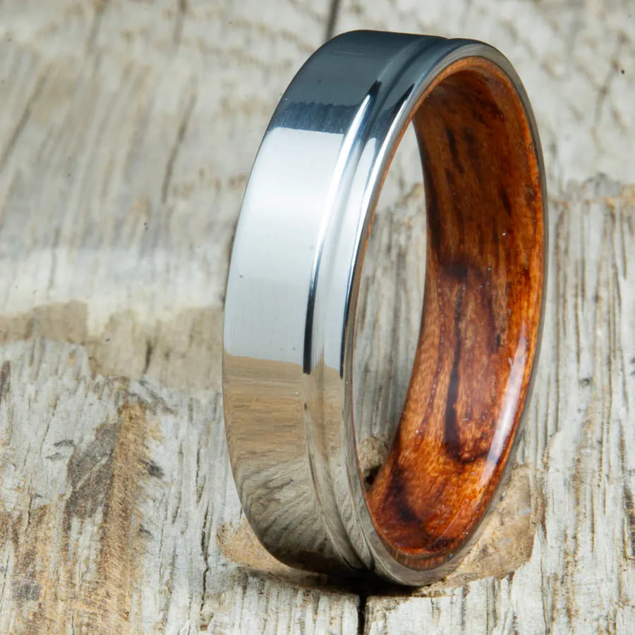 Polished titanium wedding band with Bubinga interior