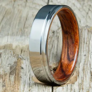 Polished titanium wedding band with Bubinga interior